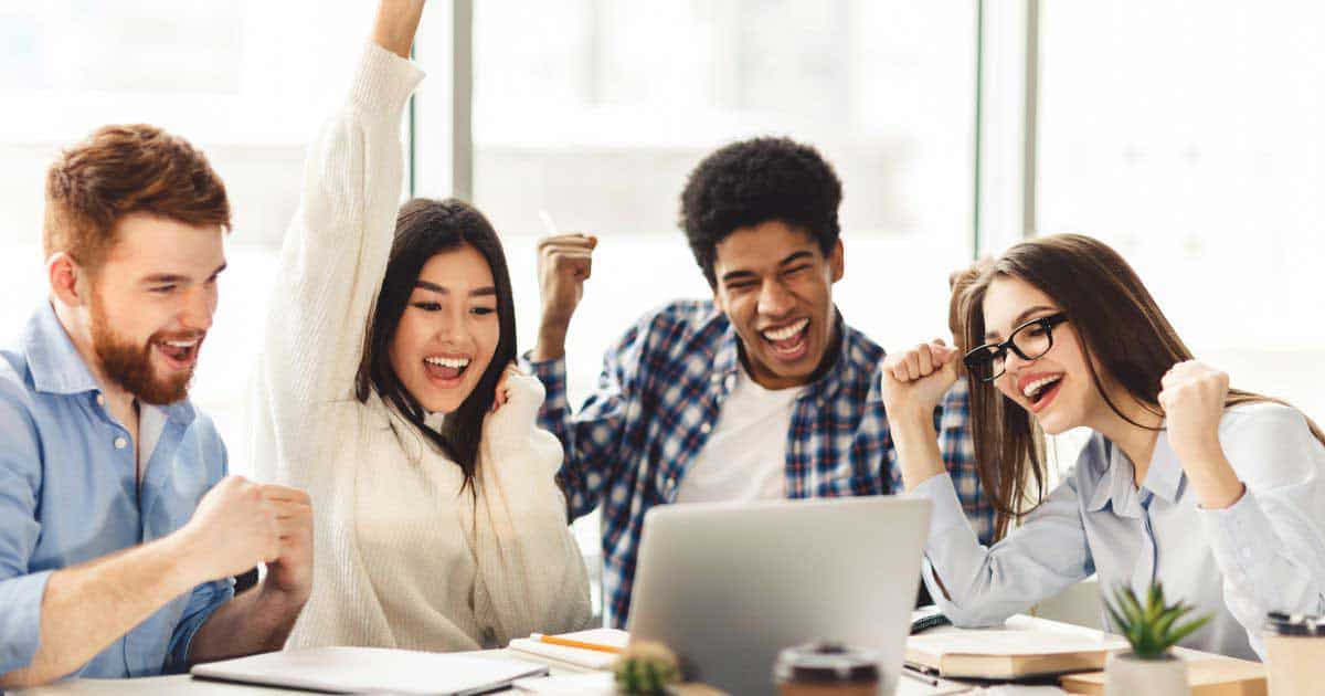 Group of Happy Students cheering after getting scholarships